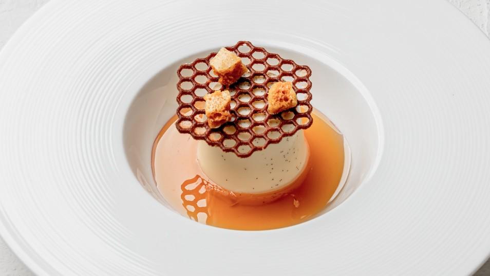 Roasted vanilla panna cotta, honey and orange blossom sauce with a sea salt tuille