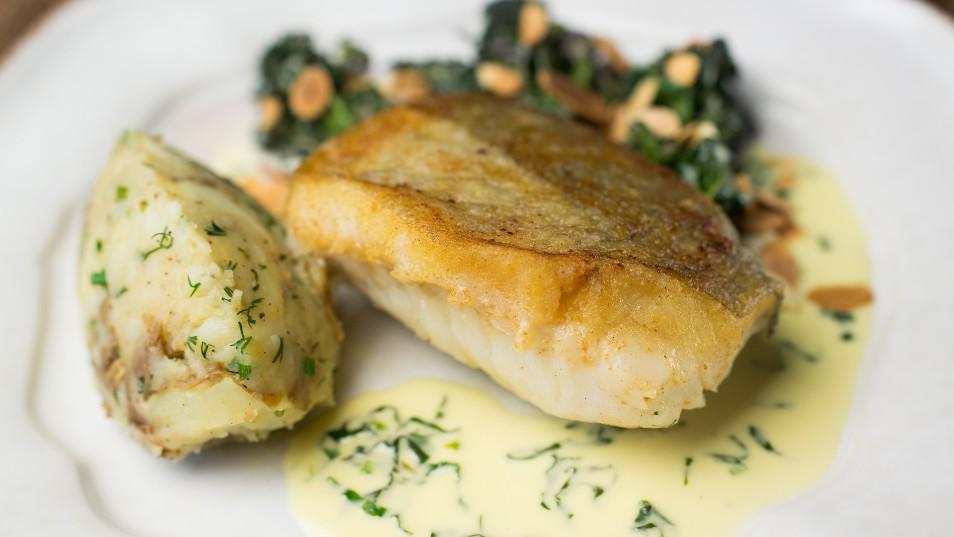 Roast cod with sprouting broccoli crushed potatoes and wild garlic butter sauce
